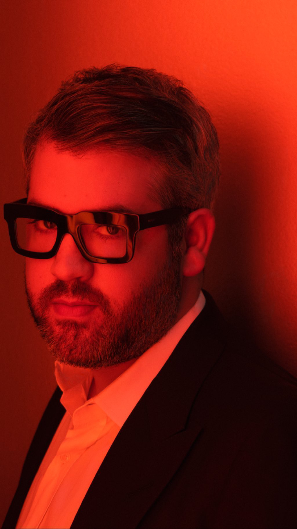 Close portrait of Brandon Maxwell in red light