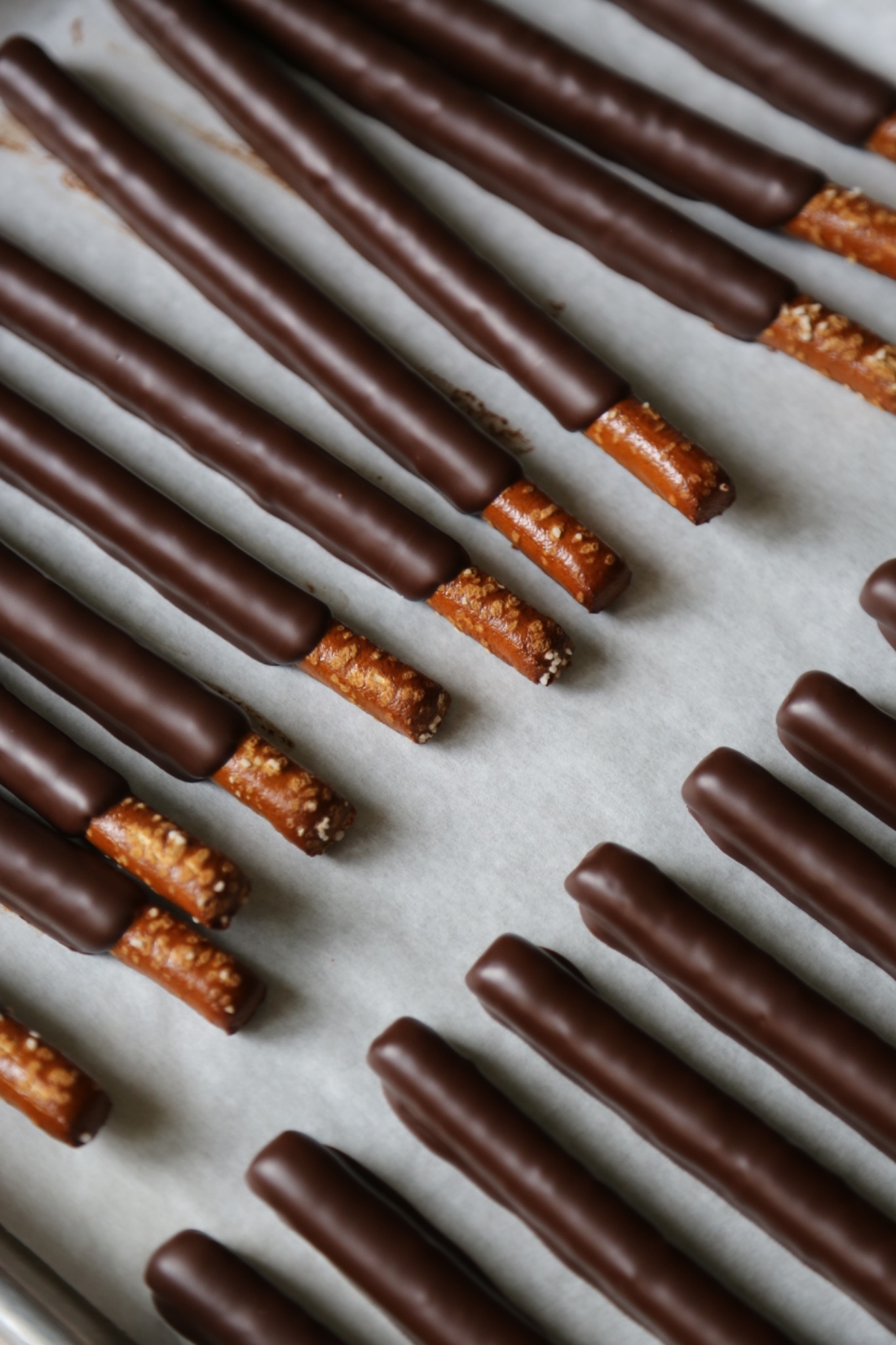Rows of chocolate-dipped pretzels