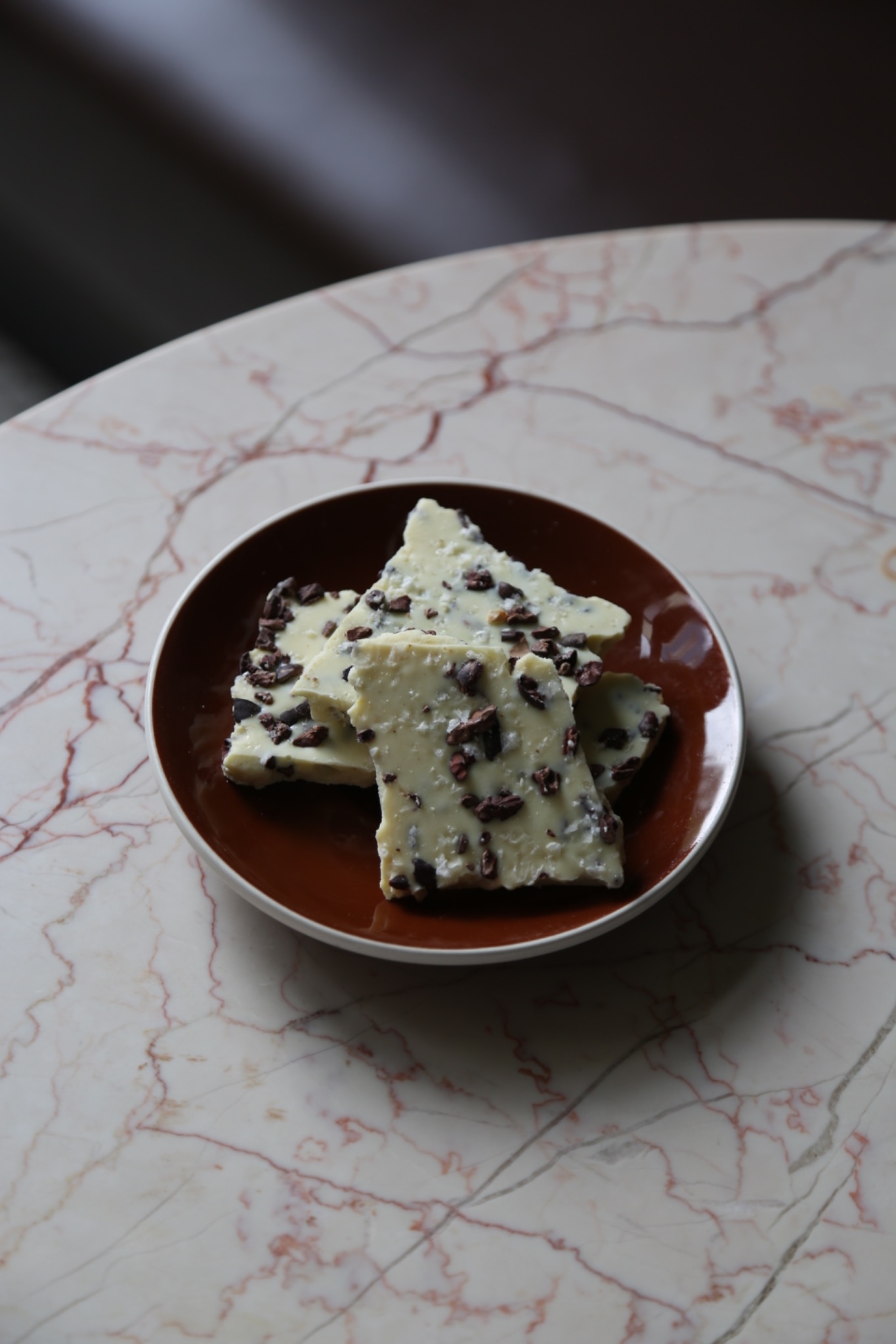 White chocolate bark on a brown plate