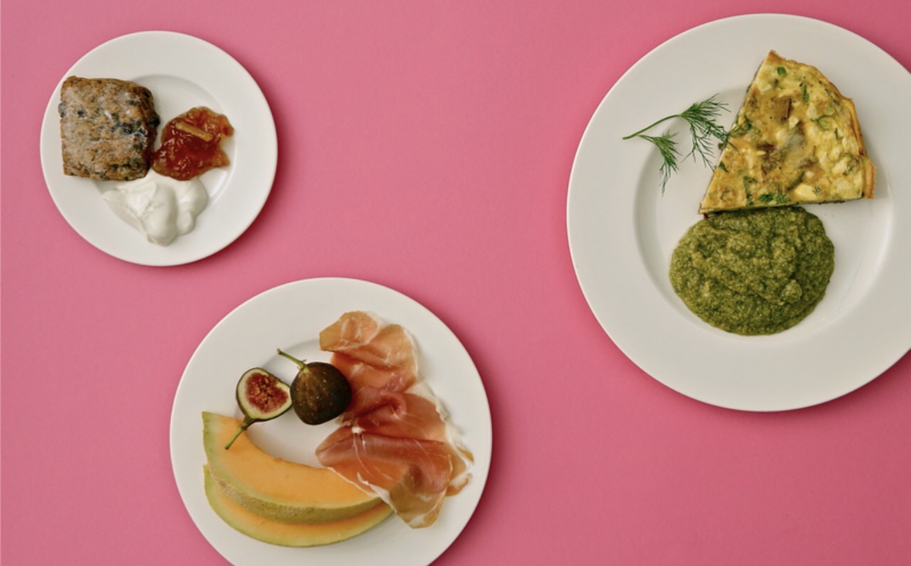 Three breakfast plates arranged on a vivid pink background