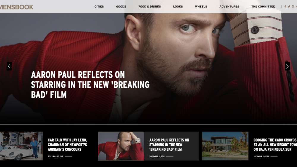 Men’s Book homepage featuring Aaron Paul and editorial navigation for cities, goods, food and drinks, looks, wheels, and adventures