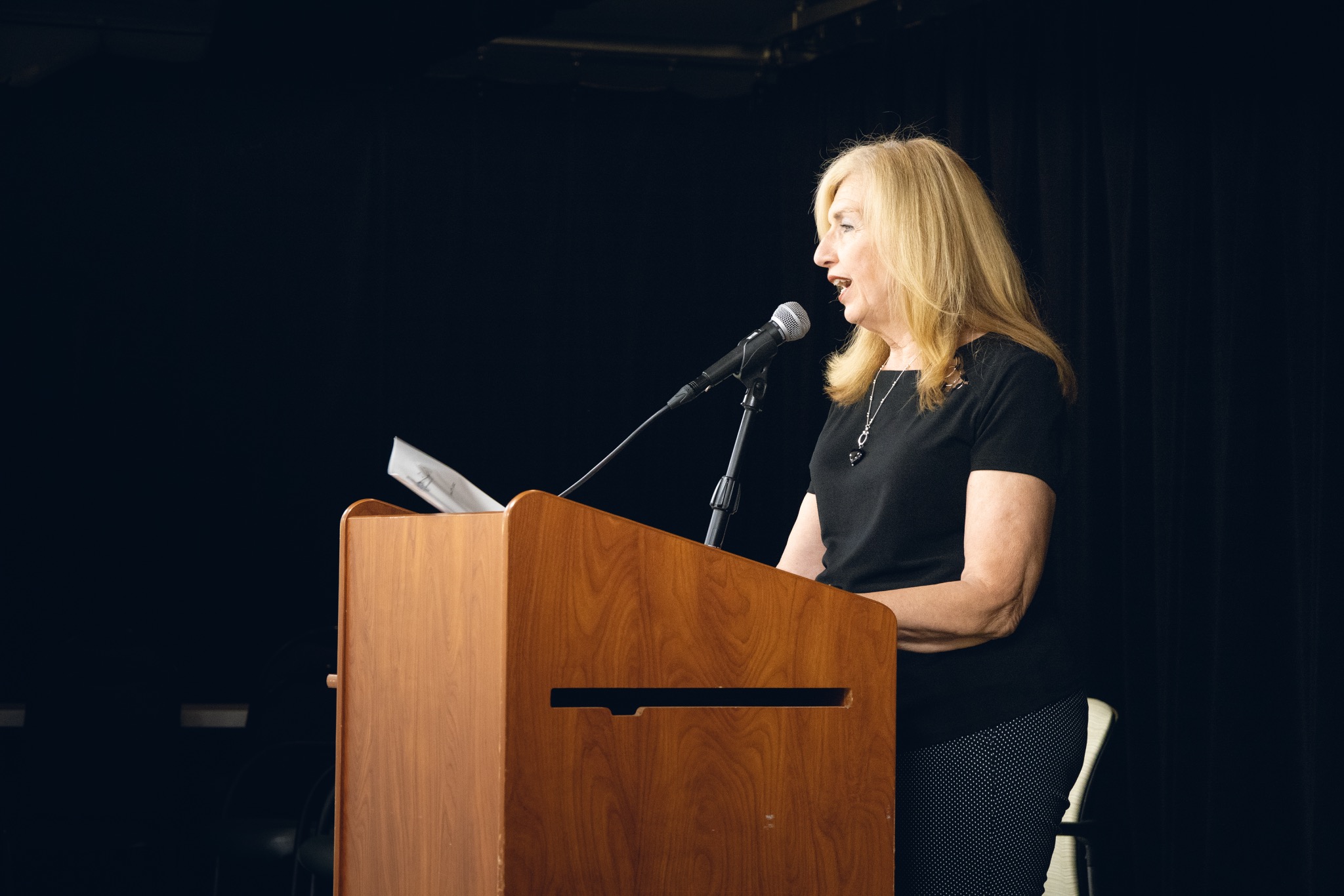 Poet speaking at a Nassau County poetry event