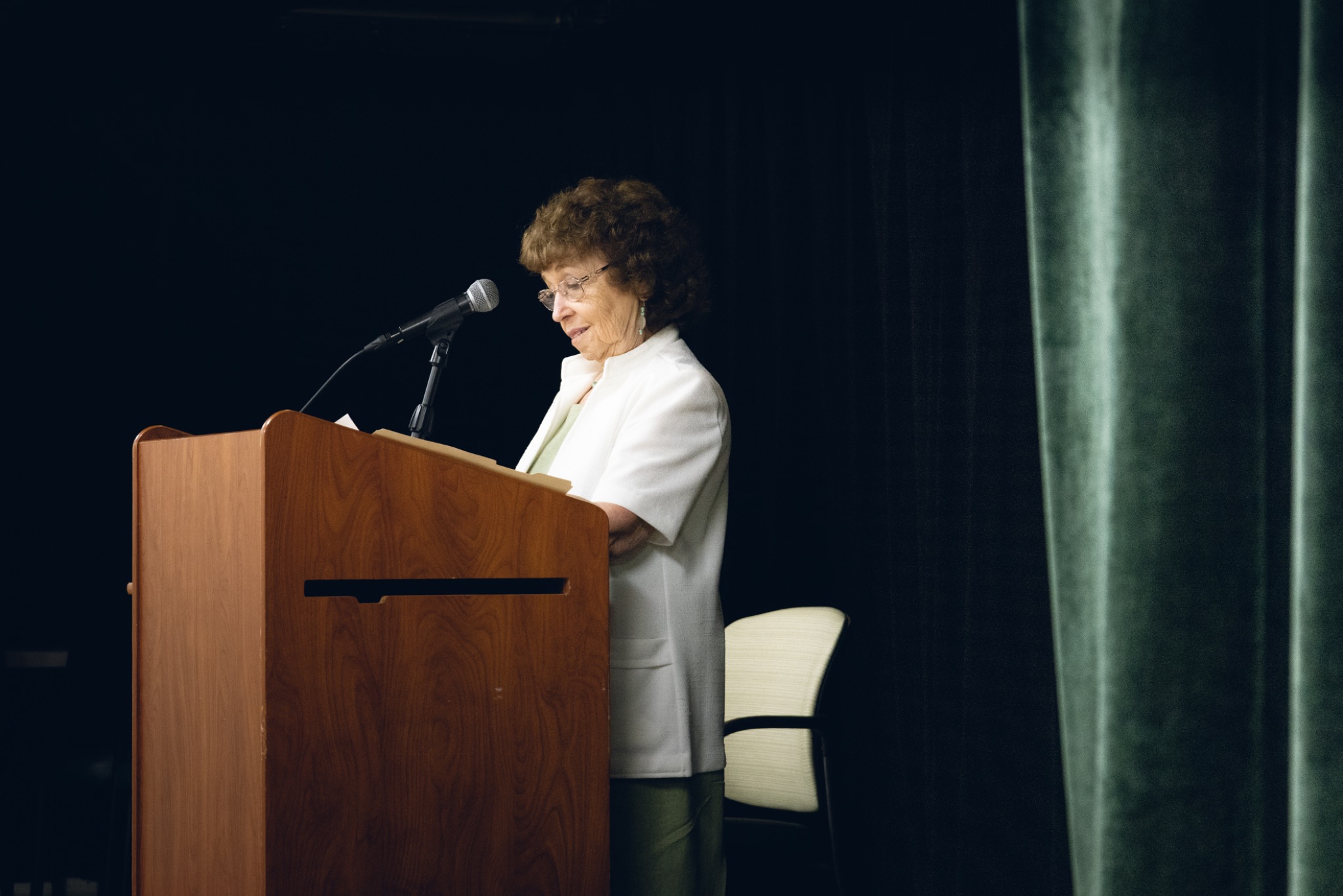 Reader at the lectern during the poetry event