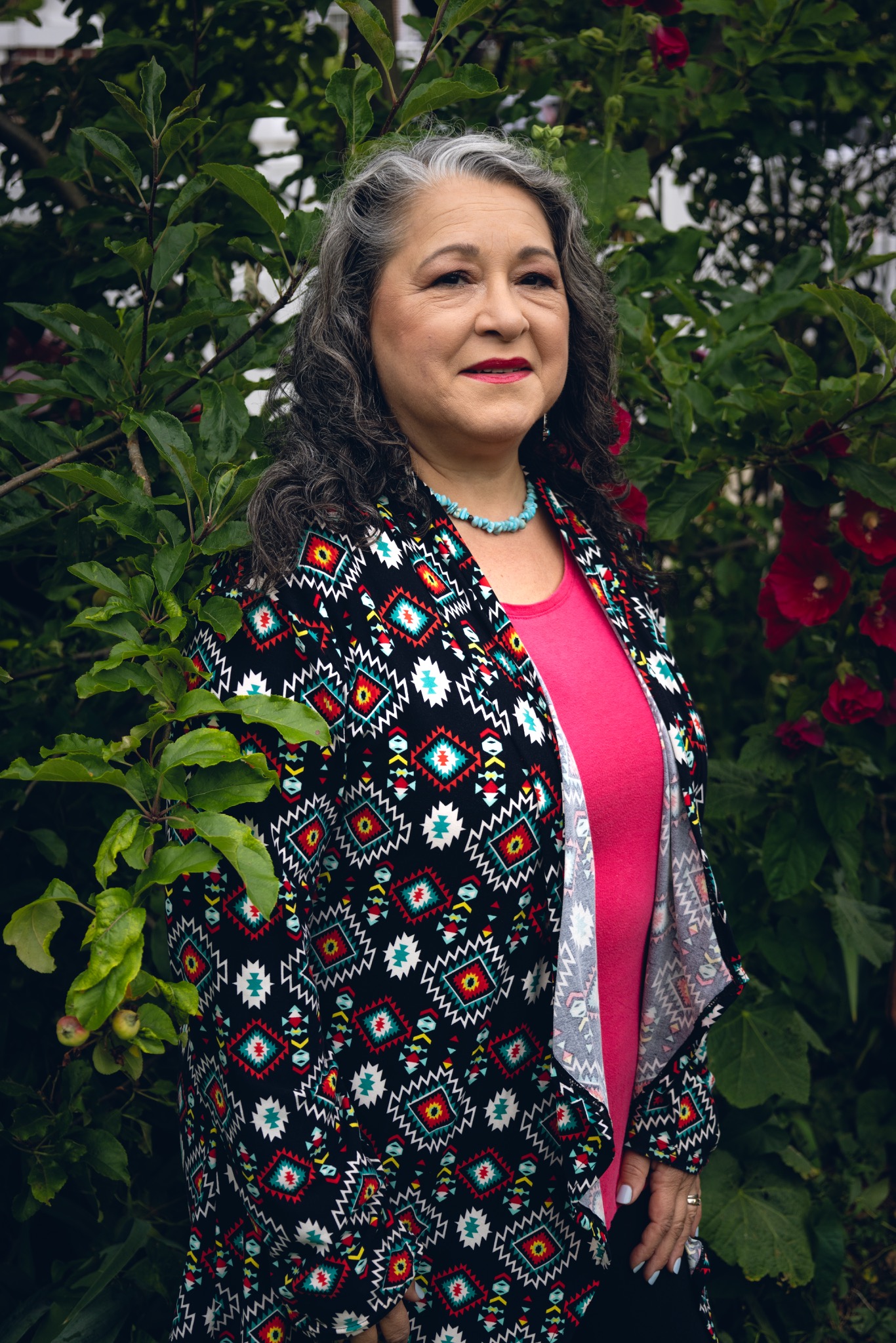 Paula Curci photographed in a garden