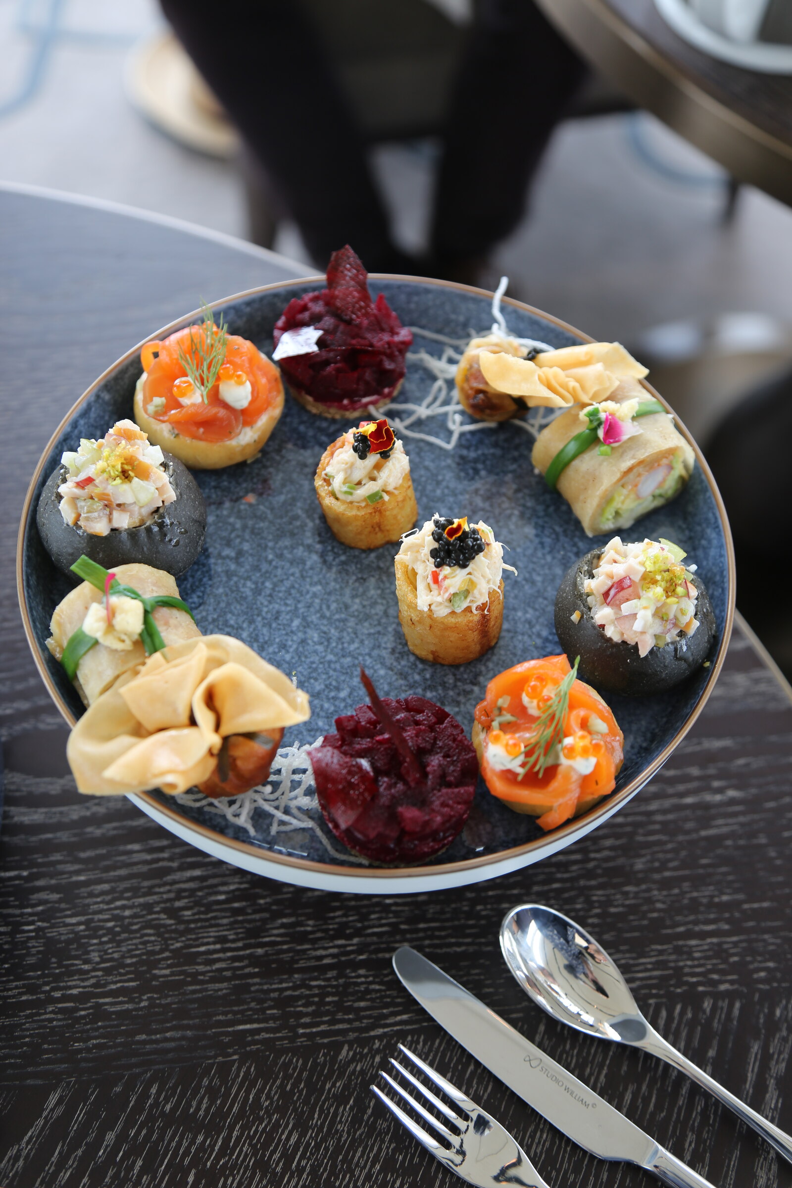 Selection of colorful savory afternoon tea bites at Waldorf Astoria Bangkok
